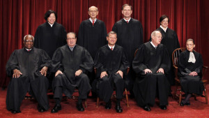 FILE - In this Oct. 8, 2010 file photo, the Supreme Court justices pose for a group photo at the Supreme Court in Washington. On Tuesday, the US Supreme Court will begin hearing two days of cases involving gay marriage. Seated, from left are, Justice Clarence Thomas, Antonin Scalia, Chief Justice John Roberts, Justice Anthony Kennedy, and Justice Ruth Bader Ginsburg. Standing, from left are, Justices Sonia Sotomayor, Stephen Breyer,  Samuel Alito Jr., and Elena Kagan. (AP Photo/Pablo Martinez Monsivais, File)