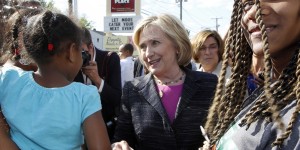 Democratic presidential candidate Hillary Rodham Clinton talks with customers during a stop for ice cream at Moo's Place, Friday, May 22, 2015, in Derry, N.H. (AP Photo/Jim Cole)