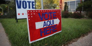 AUSTIN, TX - APRIL 28:  A bilingual sign stands outside a polling center at public library ahead of local elections on April 28, 2013 in Austin, Texas. Early voting was due to begin Monday ahead of May 11 statewide county elections. The Democratic and Republican parties are vying for the Latino vote nationwide following President Obama's landslide victory among Hispanic voters in the 2012 election.  (Photo by John Moore/Getty Images)