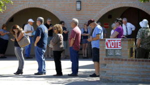 Voters wait in line to cast their ballot in Arizona's presidential primary election, Tuesday, March 22, 2016, in Gilbert, Ariz. (AP Photo/Matt York)